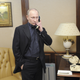 Vladimir Putin speaks on the phone at his campaign headquarters in Moscow.